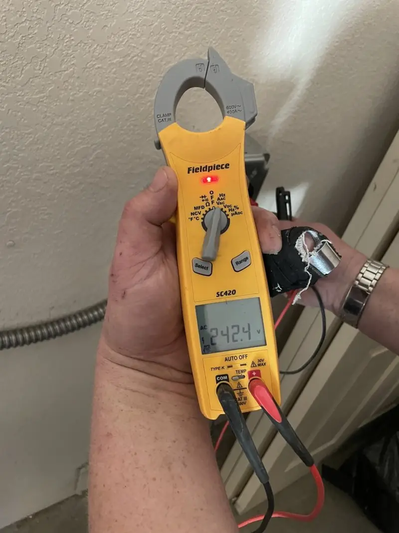 Voltage testing with clamp meter during Outlet Installation in Laurel Hill